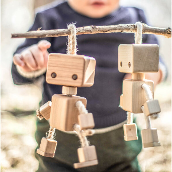 Wooden robot toys and baby playing with them
