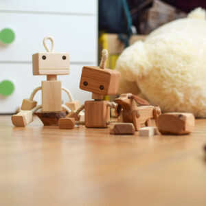 Wooden robot toy and wooden dog toy in kids room