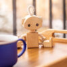 Wooden robot toy and cup of tea