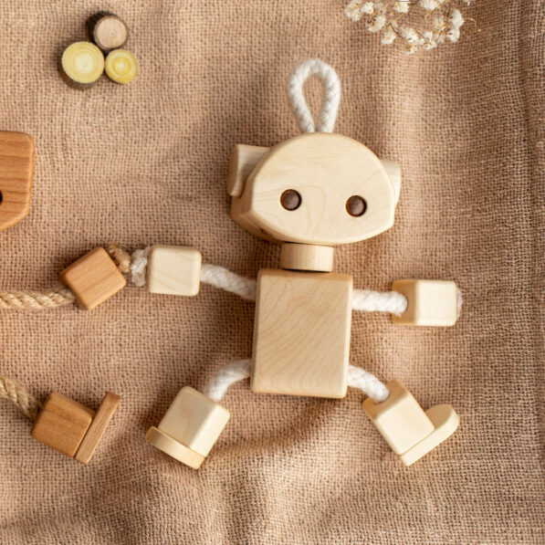 Wooden robot toy on scarf
