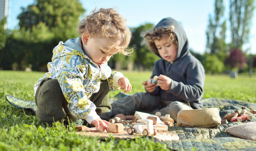Kids playing with wooden toys