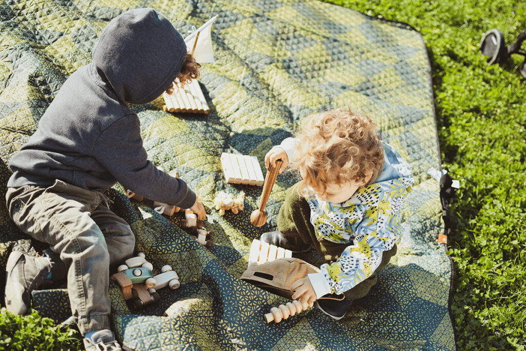 kids testing wooden toys