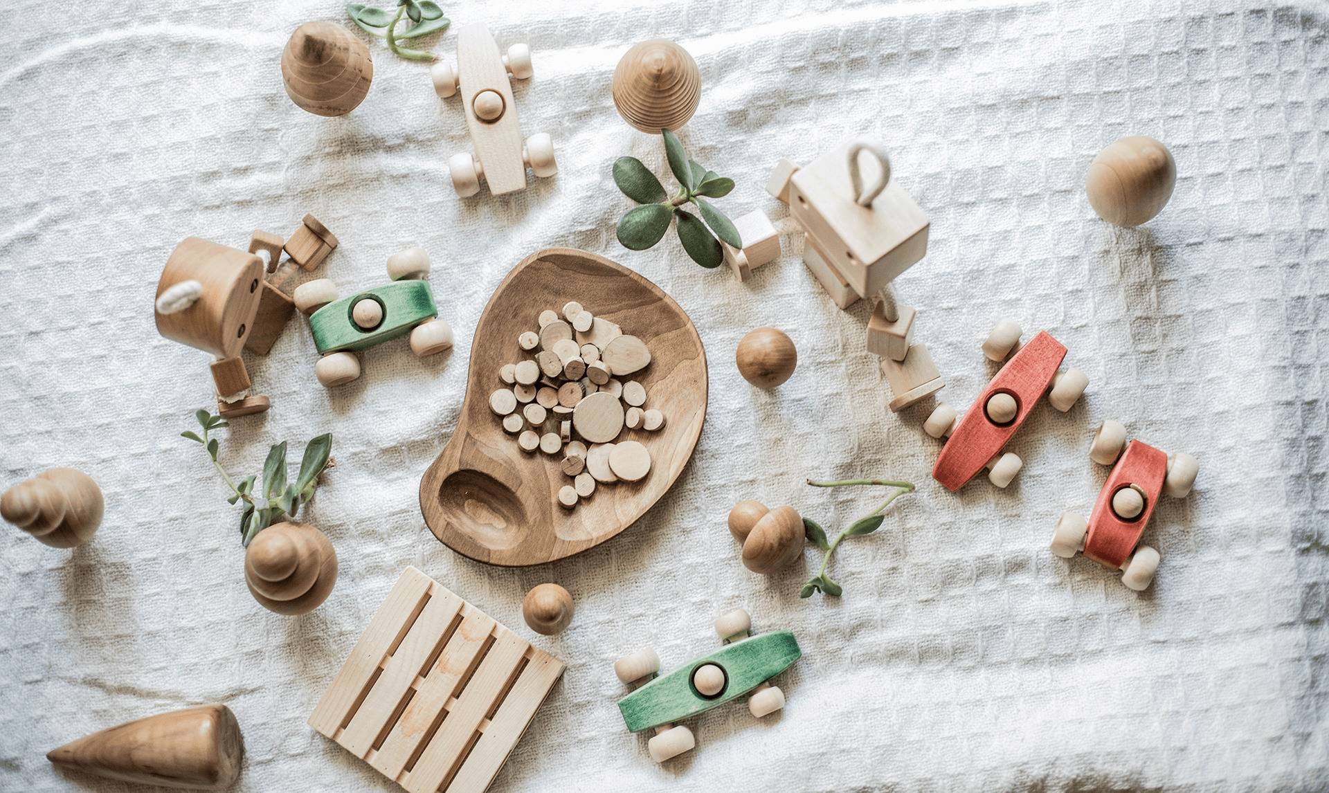wooden toys on blanket 1920x1146 1